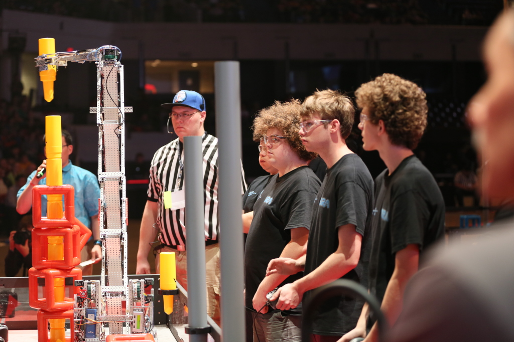 Our Worlds team watches the robots perform autonomously during the finals.